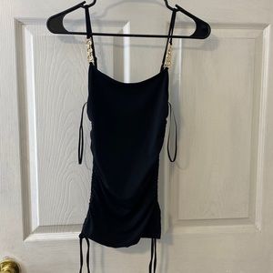 Black guess top with chain straps sides are adjustable  never used